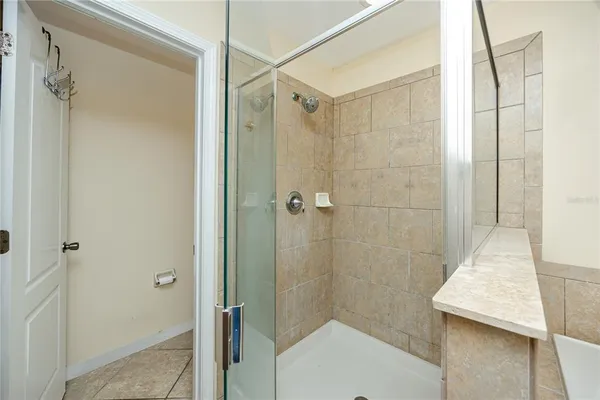 a bathroom with a shower and a shower