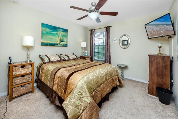 a bedroom with bed and window