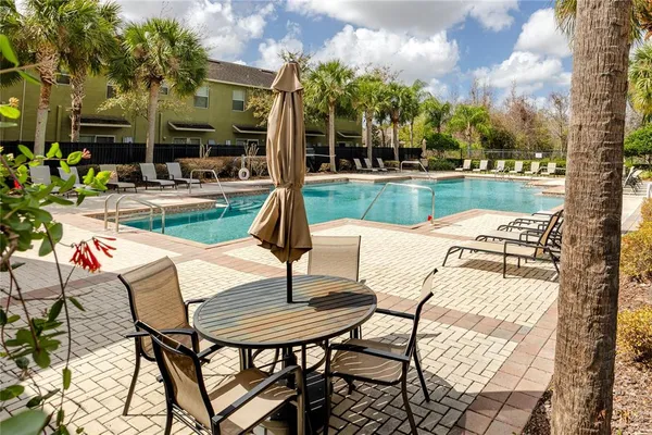 a front view of a house with a yard and a garage