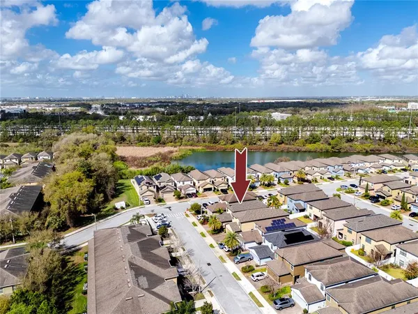 an aerial view of residential houses with outdoor space