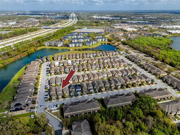 an aerial view of multiple houses with yard