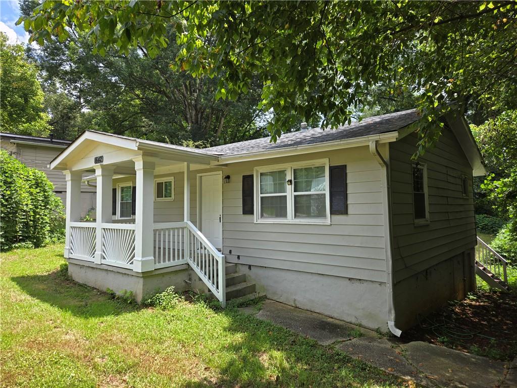 1642 Mary George Avenue Northwest Atlanta, GA 30318 - Photo 2 of 33 a view of house with a yard