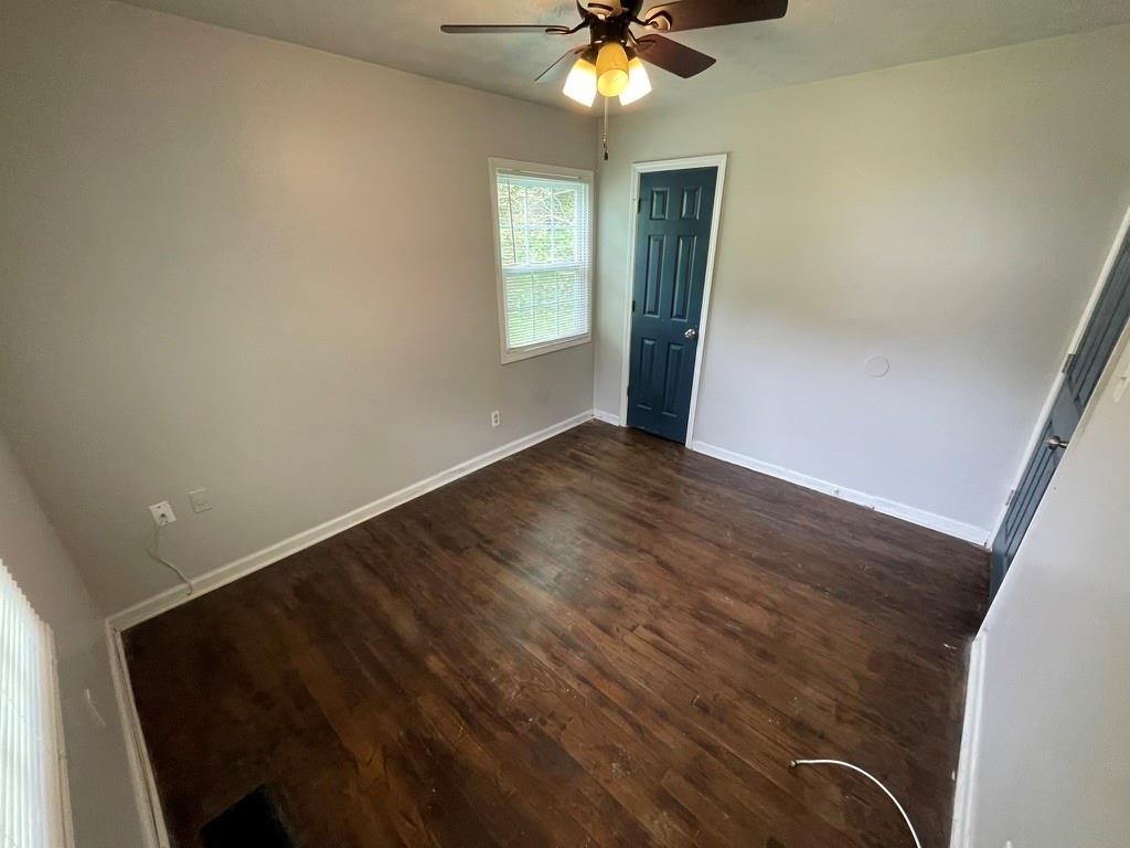 1642 Mary George Avenue Northwest Atlanta, GA 30318 - Photo 24 of 33 wooden floor in an empty room with a window