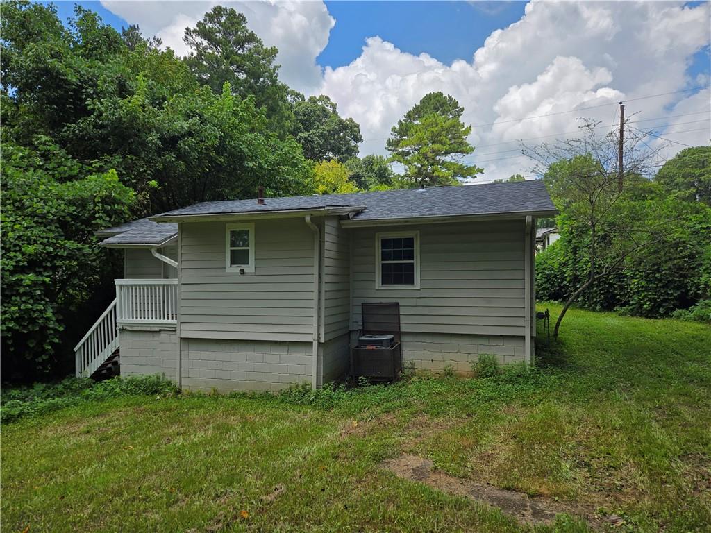 1642 Mary George Avenue Northwest Atlanta, GA 30318 - Photo 32 of 33 a view of a house with a backyard