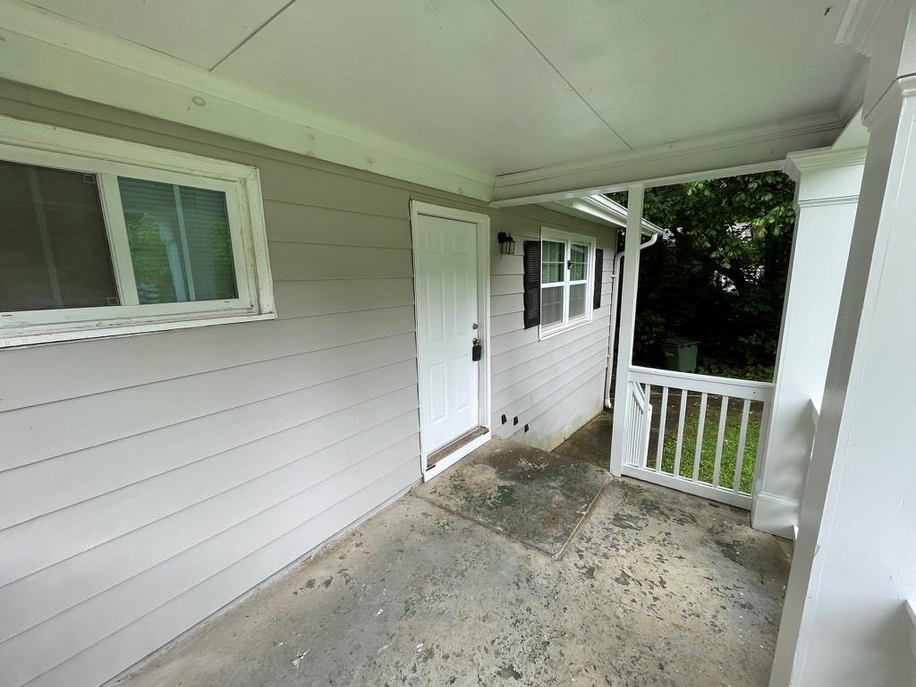 1642 Mary George Avenue Northwest Atlanta, GA 30318 - Photo 4 of 33 a view of porch with a black gate