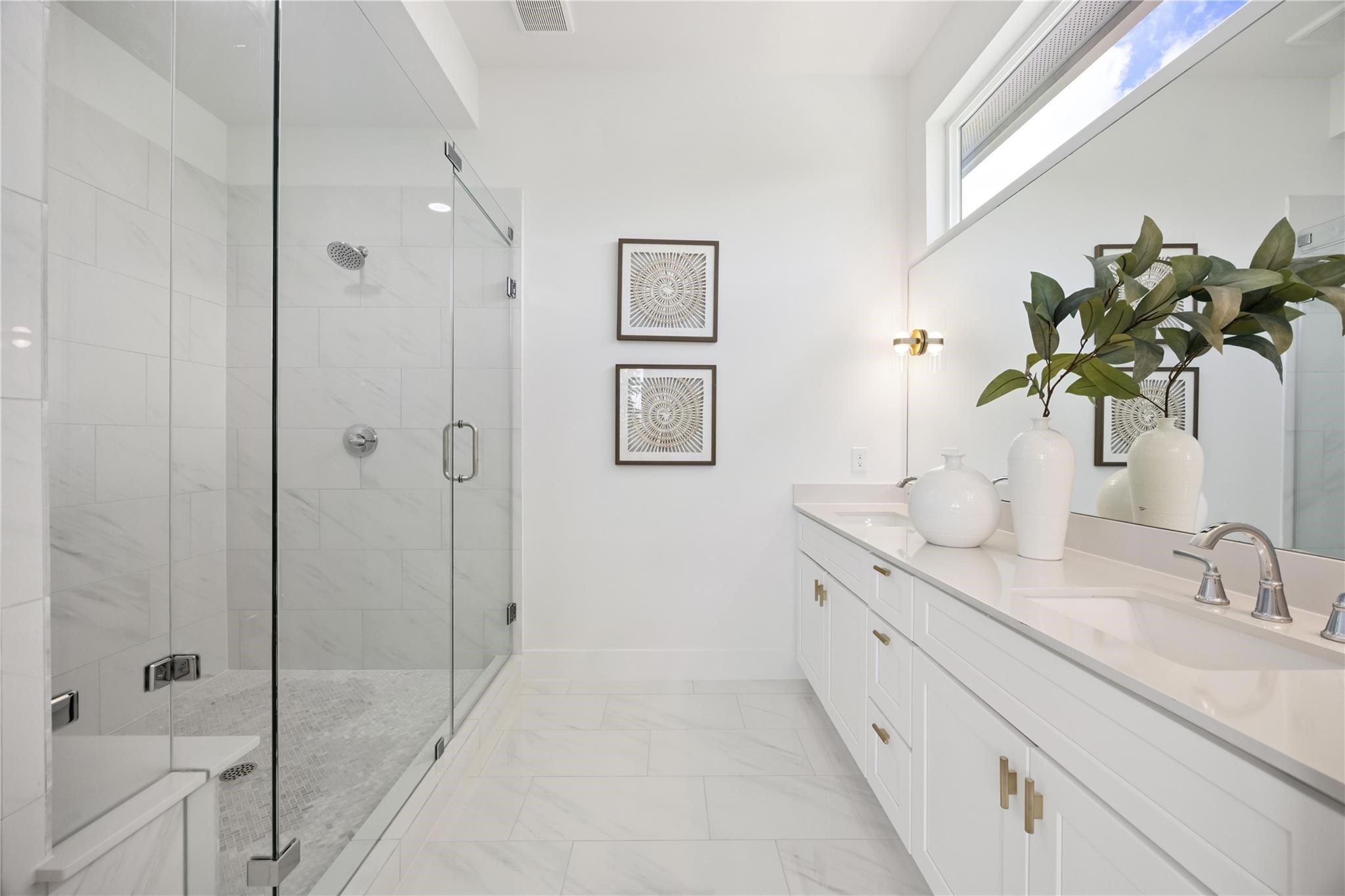 835 Rachel Street, Unit D Houston, TX 77091 - Photo 16 of 22 a bathroom with a granite countertop sink a mirror and a shower