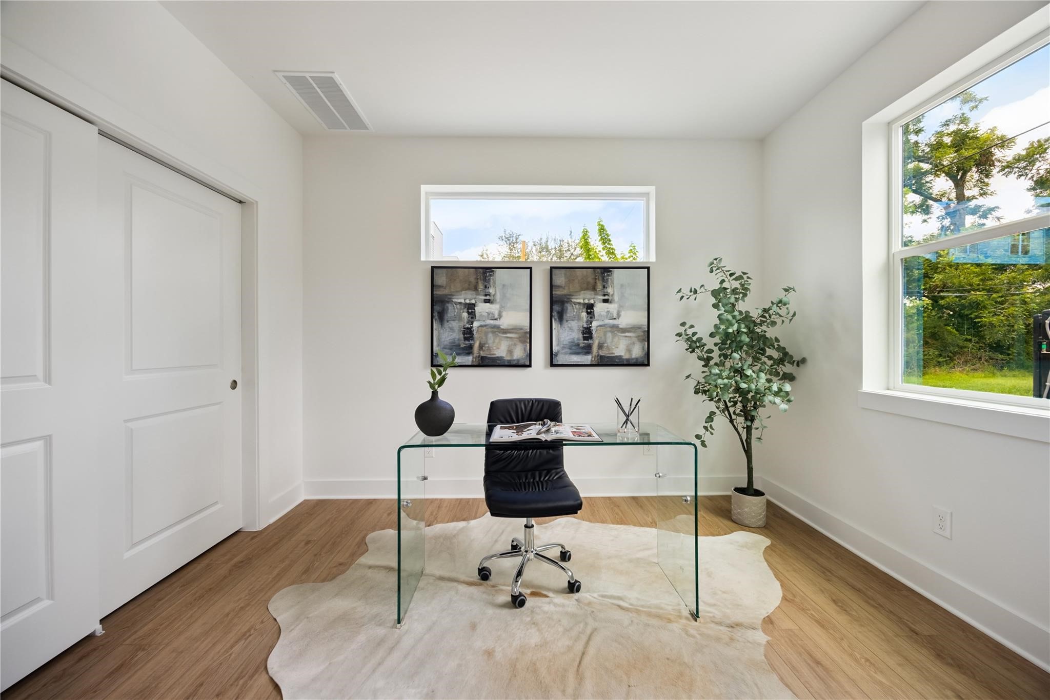 835 Rachel Street, Unit D Houston, TX 77091 - Photo 18 of 22 a work room with furniture and potted plant