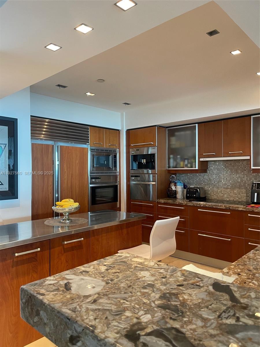 1331 Brickell Bay Drive, Unit 3607 Miami, FL 33131 - Photo 13 of 35 a swimming pool with a large window and couch