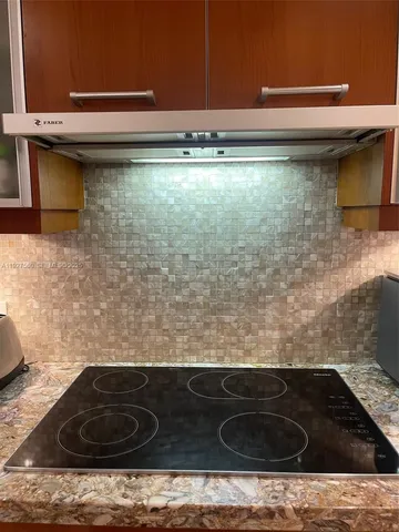 a refrigerator freezer sitting inside of a kitchen