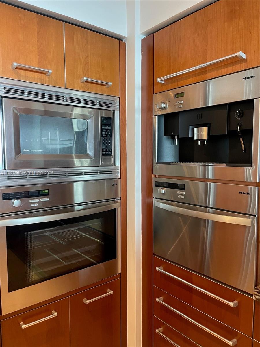 1331 Brickell Bay Drive, Unit 3607 Miami, FL 33131 - Photo 15 of 35 a refrigerator freezer sitting inside of a kitchen
