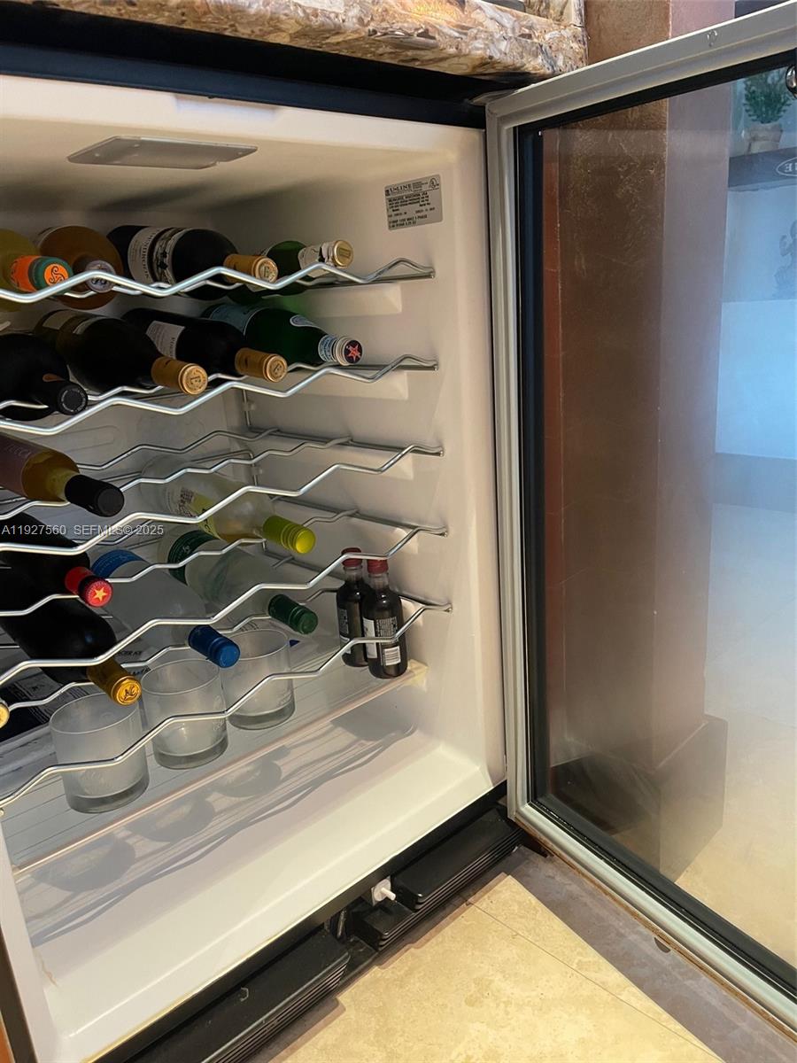 1331 Brickell Bay Drive, Unit 3607 Miami, FL 33131 - Photo 17 of 35 a view of walk in closet with clothes and shoes