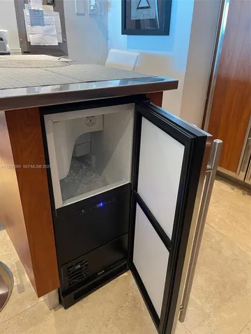 a kitchen with stainless steel appliances granite countertop a stove top oven sink and cabinets