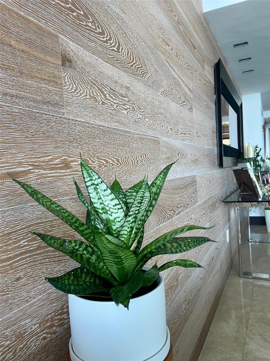 1331 Brickell Bay Drive, Unit 3607 Miami, FL 33131 - Photo 23 of 35 a white vase with flowers on a table