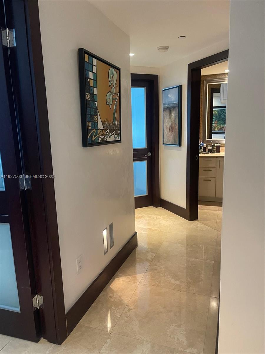 1331 Brickell Bay Drive, Unit 3607 Miami, FL 33131 - Photo 31 of 35 a view of a hallway with wooden floor