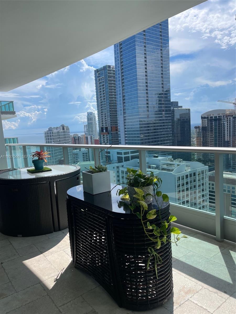 1331 Brickell Bay Drive, Unit 3607 Miami, FL 33131 - Photo 32 of 35 a view of a chairs and table in the terrace