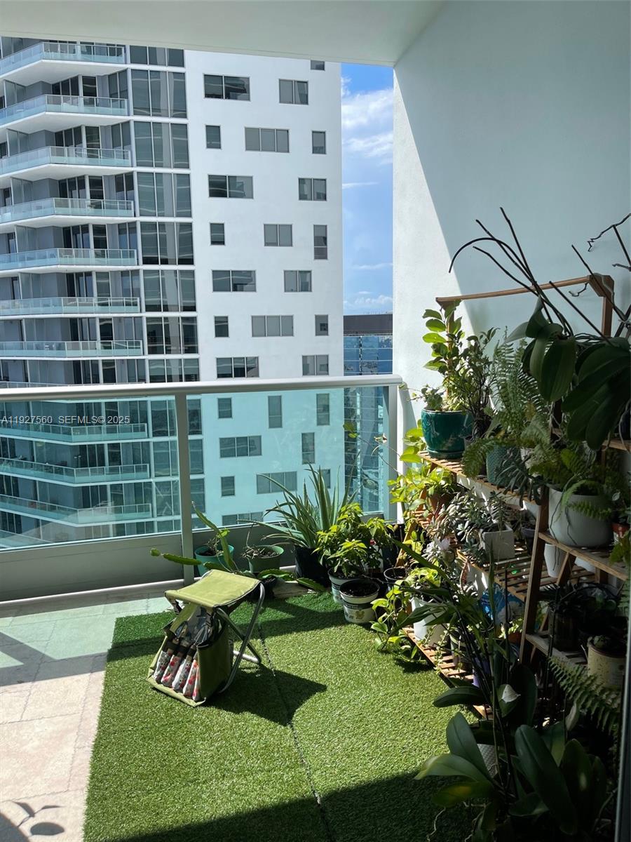 1331 Brickell Bay Drive, Unit 3607 Miami, FL 33131 - Photo 33 of 35 a view of a chair and table in a garden