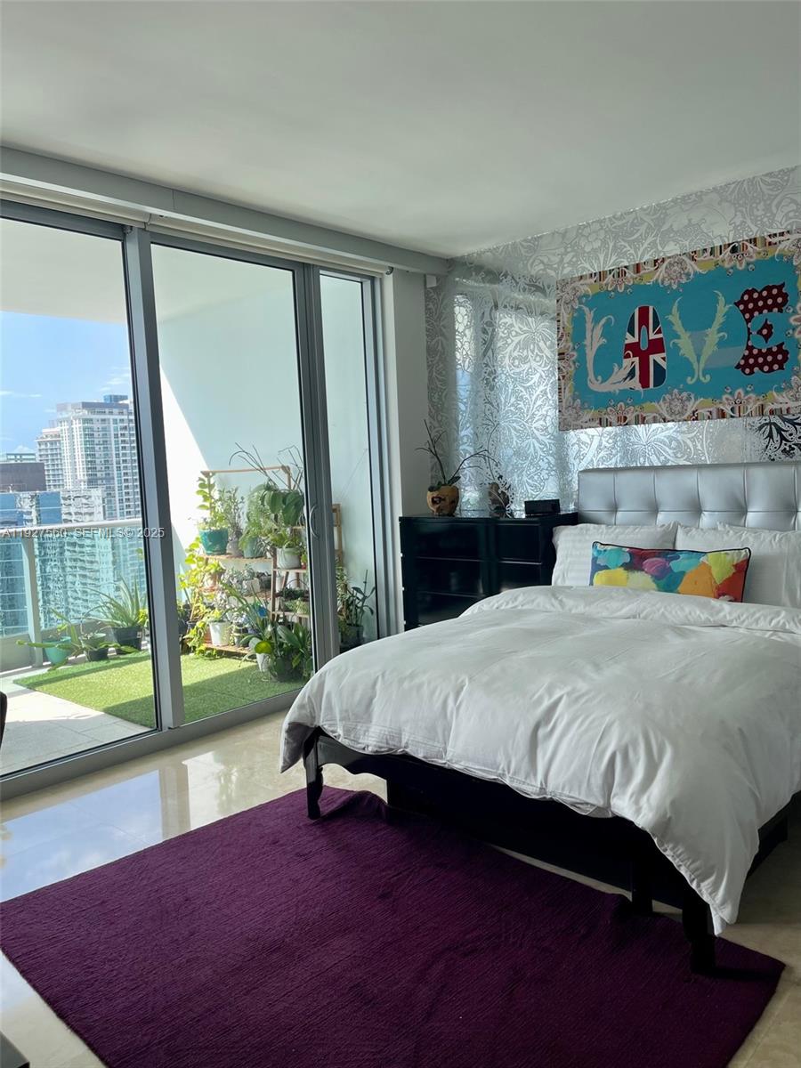 1331 Brickell Bay Drive, Unit 3607 Miami, FL 33131 - Photo 35 of 35 a bed sitting in a bedroom next to a window