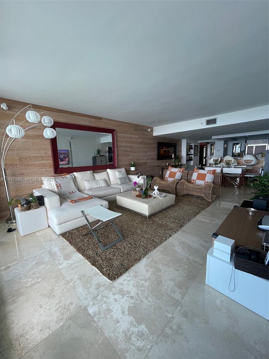 1331 Brickell Bay Drive, Unit 3607 Miami, FL 33131 - Photo 6 of 35 a living room with furniture and a rug