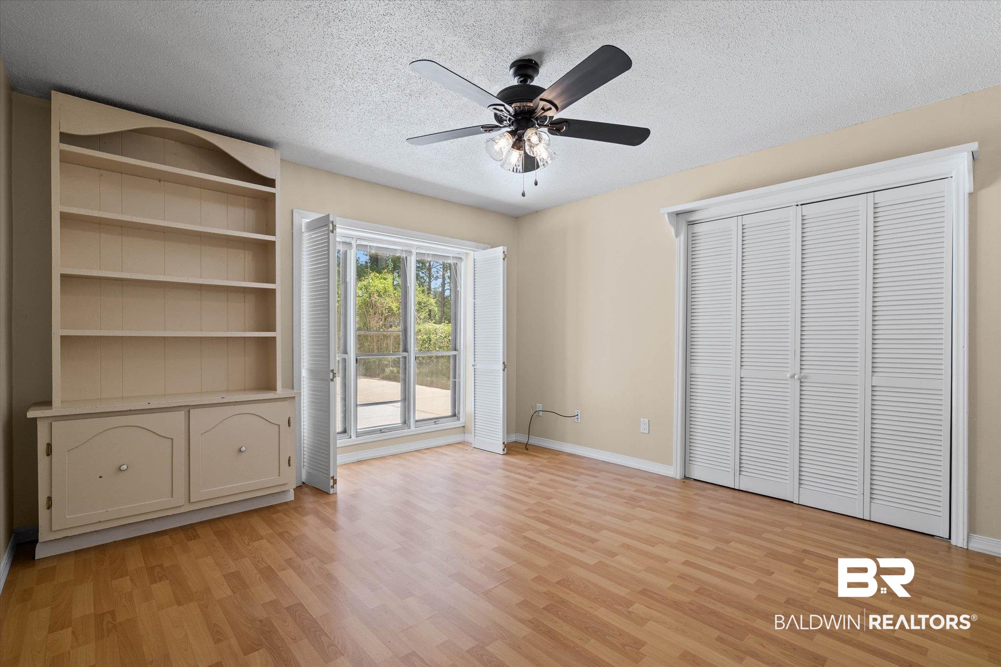 3724 Claridge Road South Mobile, AL 36608 - Photo 28 of 42 Unfurnished bedroom featuring a textured ceiling, light wood-style flooring, ceiling fan, and a closet