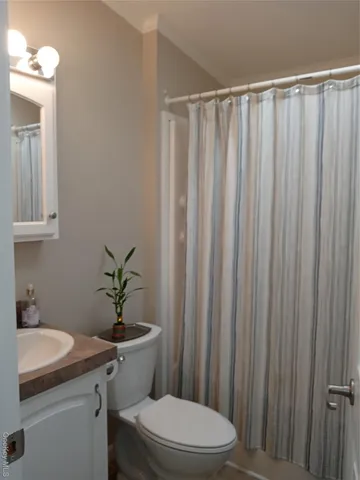 a bathroom with a sink a toilet and tub