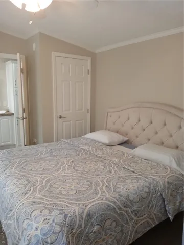 a large bed sitting in a bedroom and closet