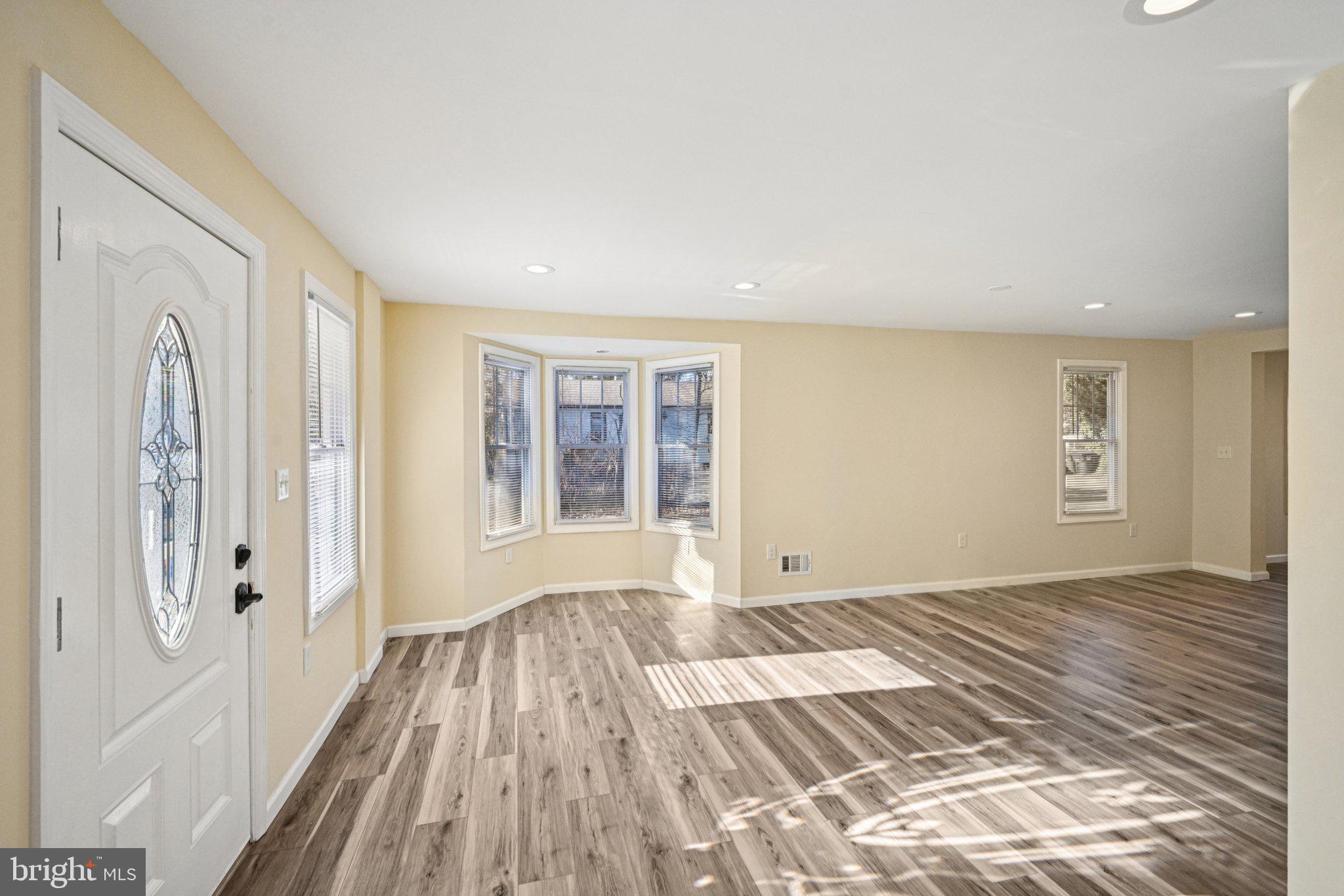 195 Chews Landing Road Clementon, NJ 08021 - Photo 10 of 48 a view of a livingroom with wooden floor and windows