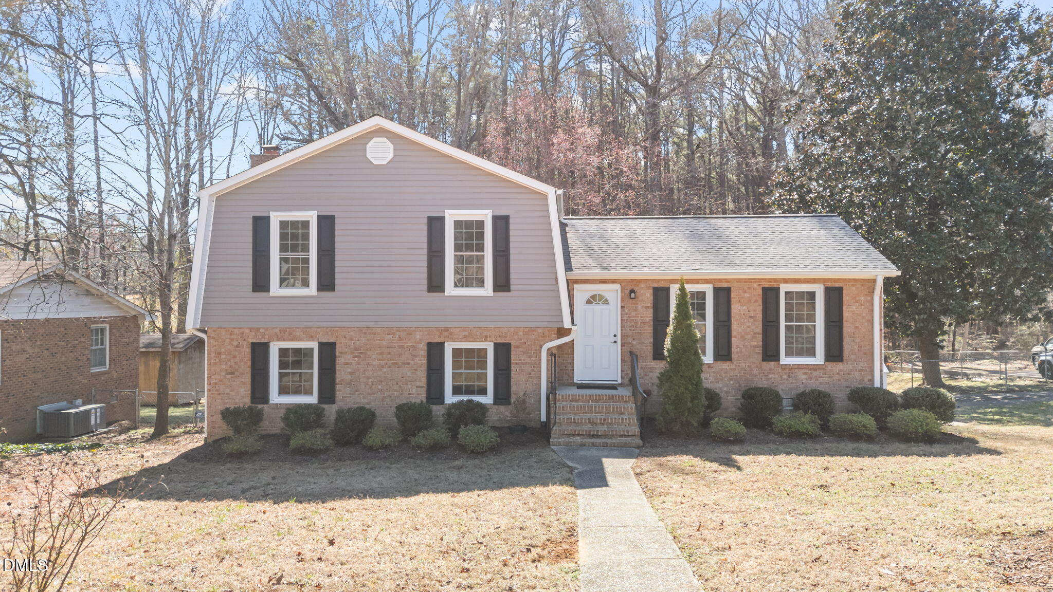 205 November Street Garner, NC 27529 - Photo 2 of 26 a front view of a house with a yard covered with snow