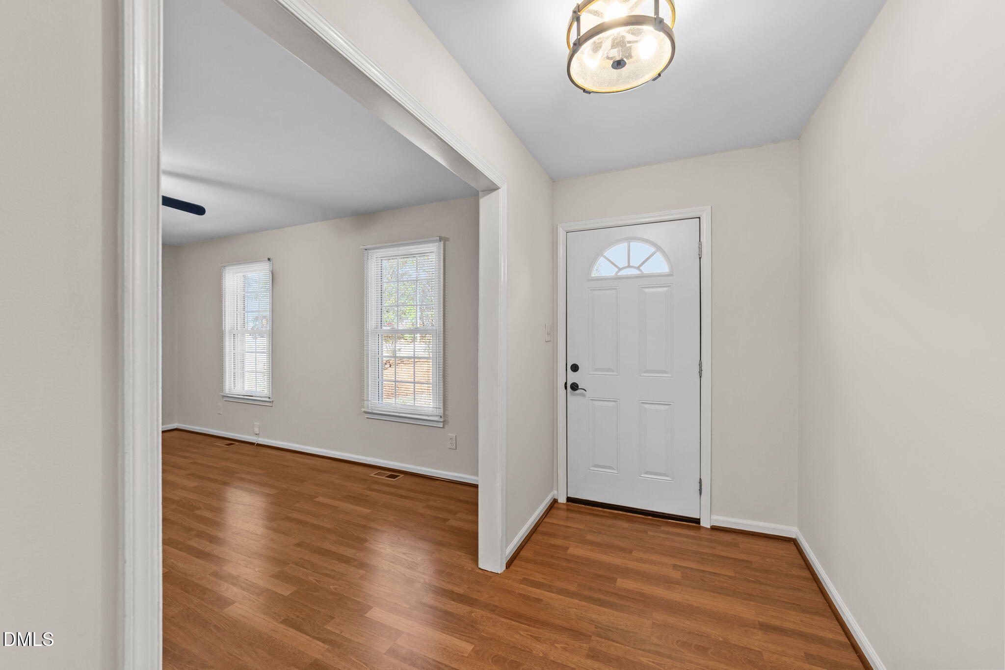 205 November Street Garner, NC 27529 - Photo 5 of 26 a view of livingroom with hardwood floor and window