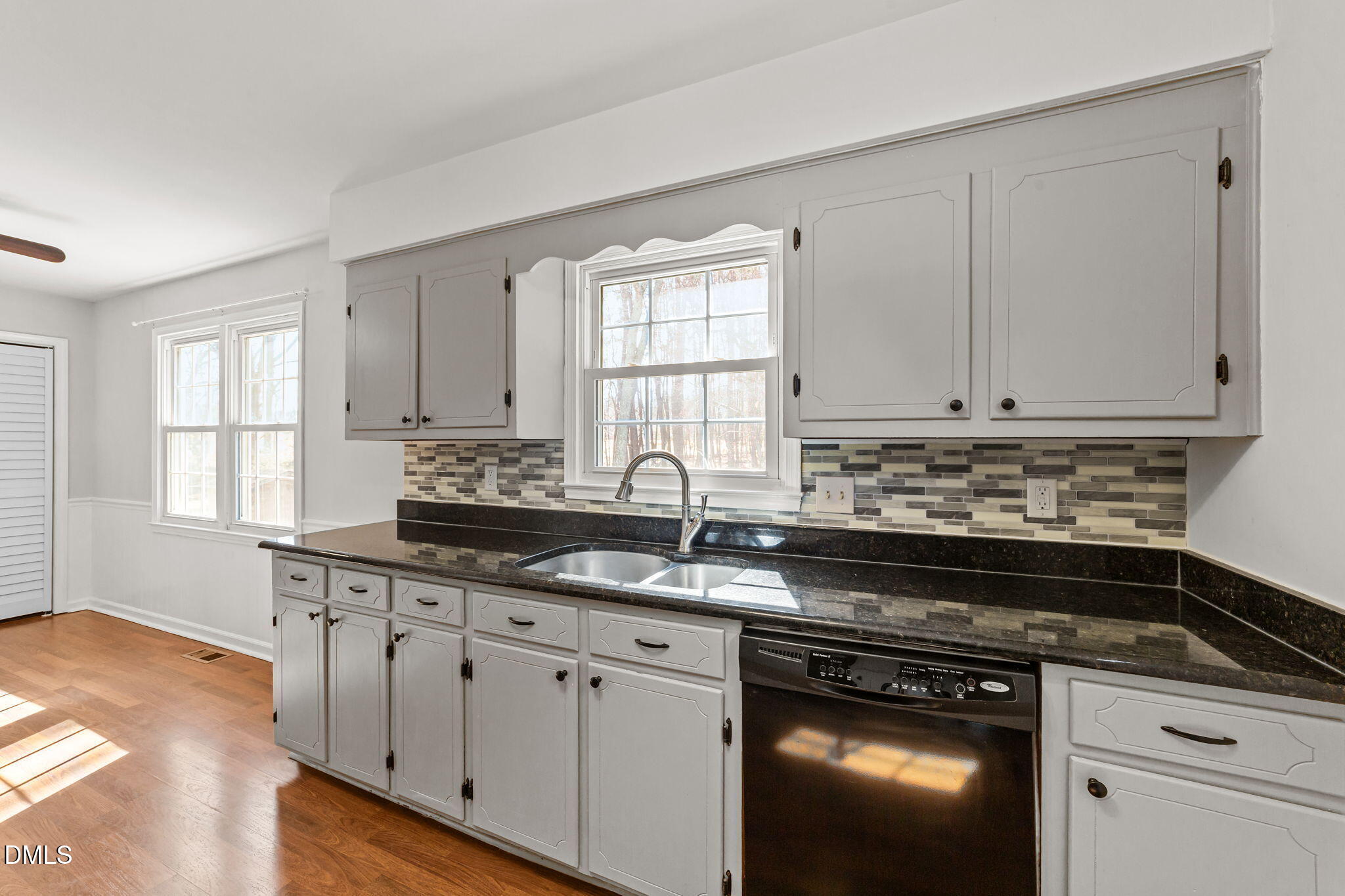 205 November Street Garner, NC 27529 - Photo 8 of 26 a kitchen with granite countertop white cabinets and appliances