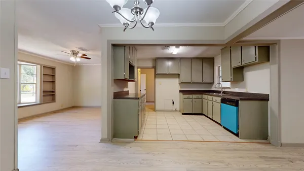 a kitchen with a refrigerator and a sink