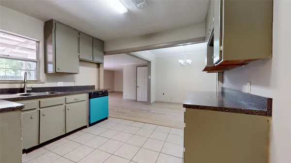 a kitchen with stainless steel appliances granite countertop a sink and a stove