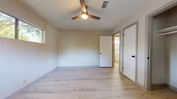 a view of an empty room with a window