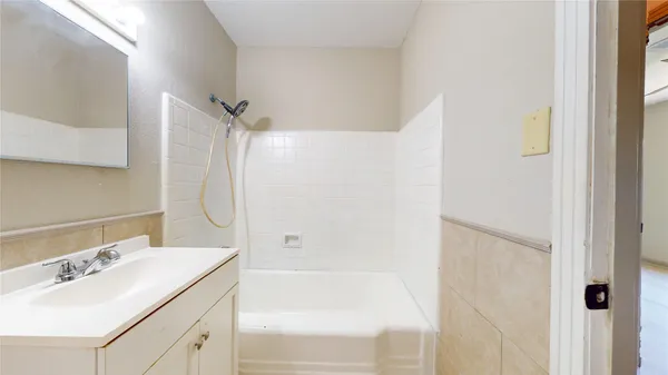 a bathroom with a sink and a shower