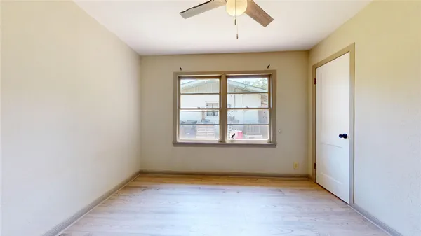 an empty room with a empty space and windows