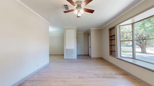 a view of an empty room with a window