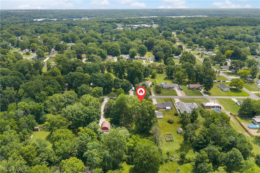 5768 Nolley Road Akron, OH 44319 - Photo 33 of 38 Expansive aerial perspective showcasing a residential area characterized by abundant mature trees and verdant landscapes