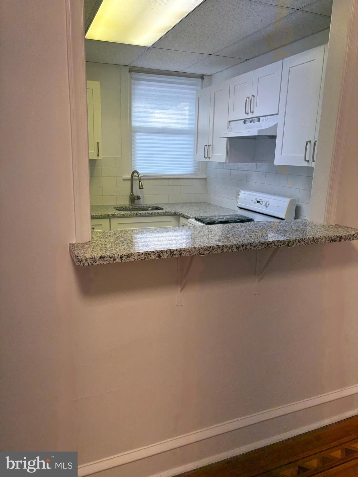 1934 73rd Avenue Philadelphia, PA 19138 - Photo 13 of 48 a view of a kitchen counter space and wooden floor