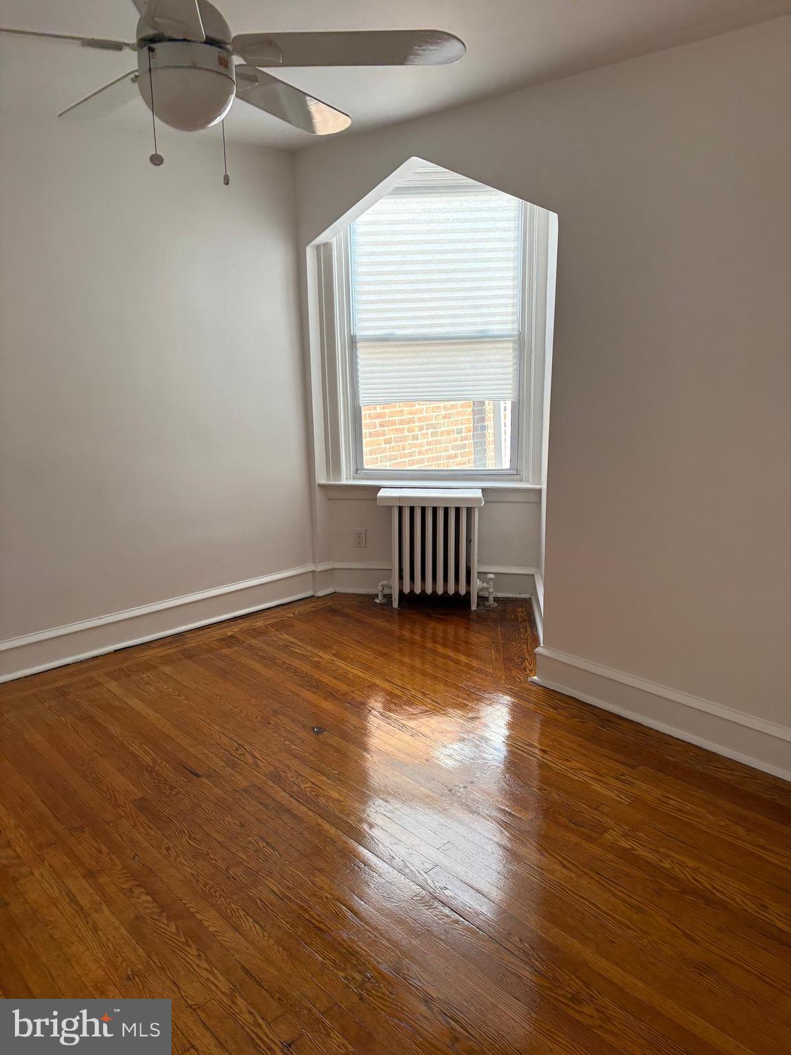 1934 73rd Avenue Philadelphia, PA 19138 - Photo 29 of 48 an empty room with wooden floor and windows
