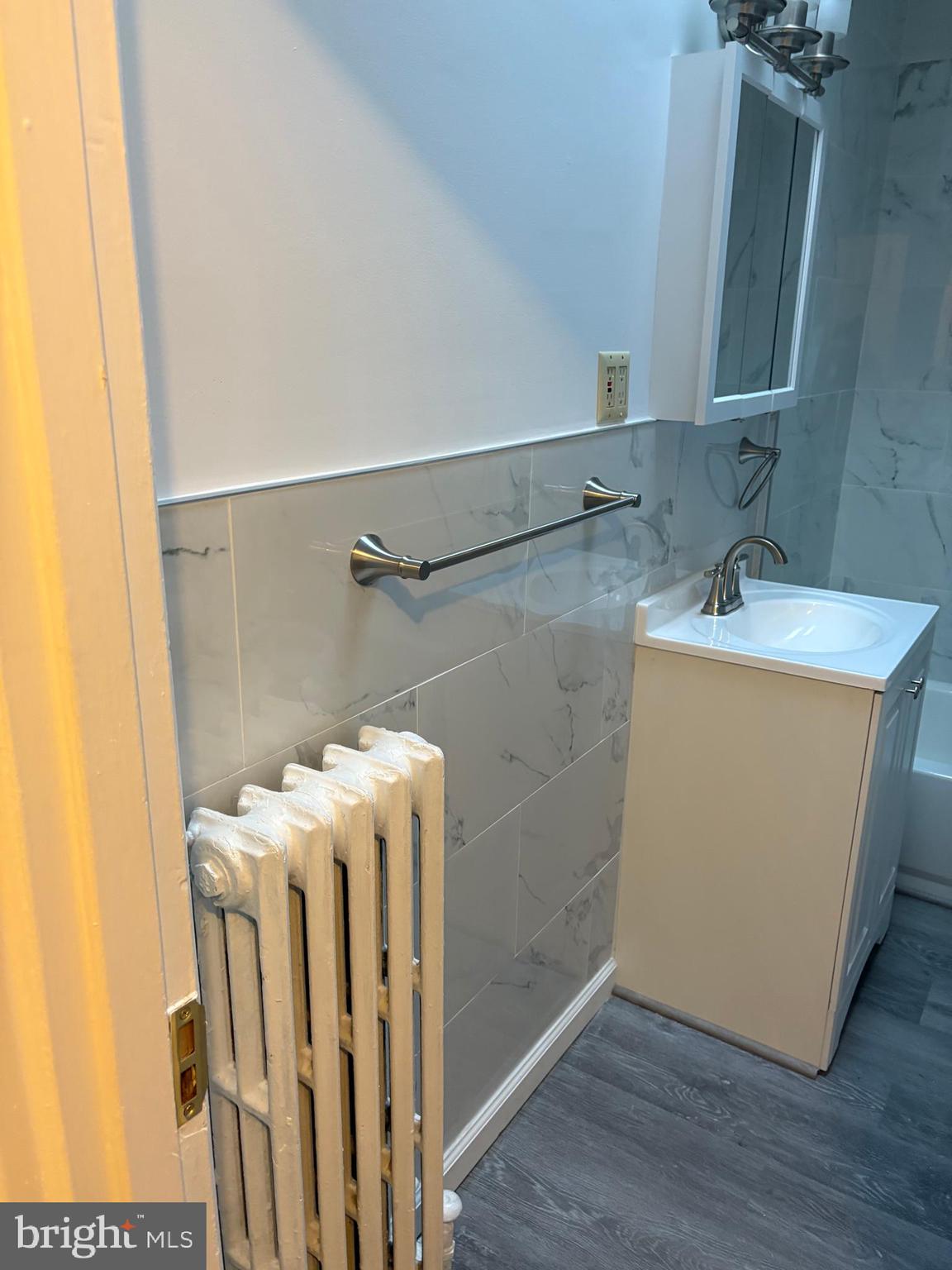 1934 73rd Avenue Philadelphia, PA 19138 - Photo 31 of 48 a bathroom with a sink and mirror