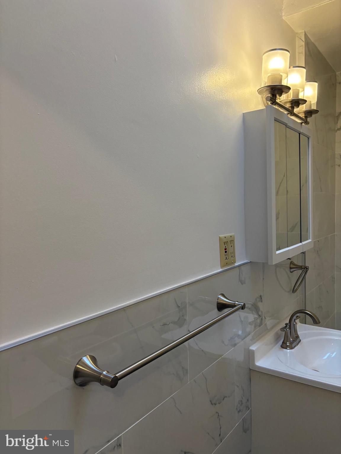 1934 73rd Avenue Philadelphia, PA 19138 - Photo 36 of 48 a bathroom with a sink and a mirror