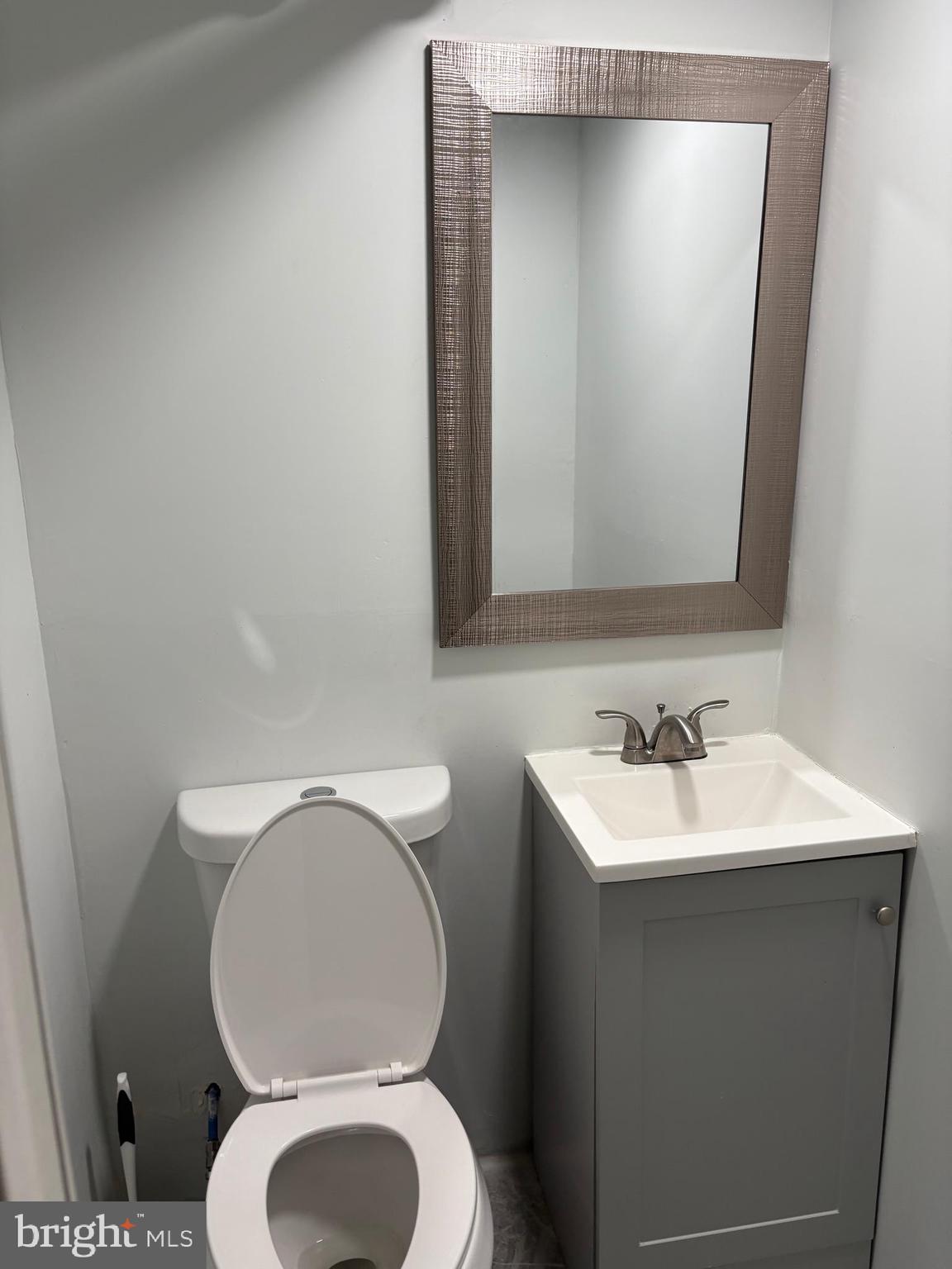 1934 73rd Avenue Philadelphia, PA 19138 - Photo 42 of 48 a bathroom with a toilet sink and mirror