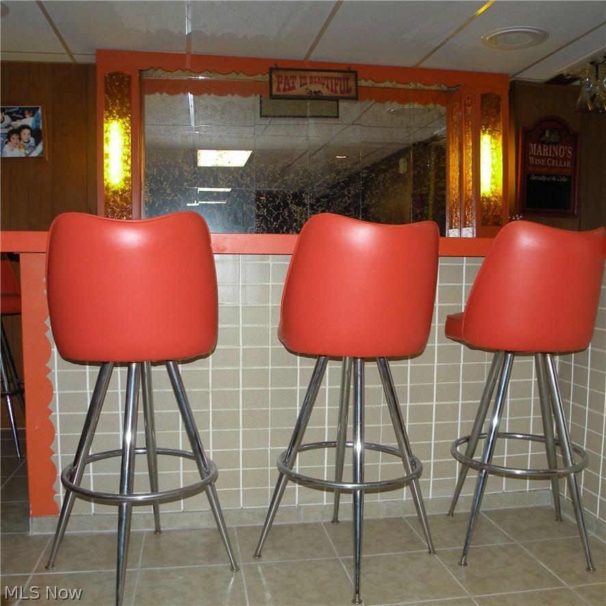 403 Rutland Street Akron, OH 44305 - Photo 23 of 26 The bar is a great place for all to socialize; notice the retro orange bar stools!