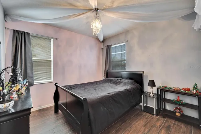 a bedroom with a bed and a dresser