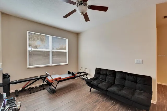 a living room with furniture and a window