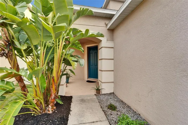a path view of a house with a yard