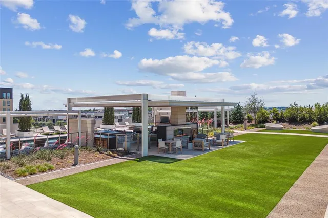 a view of a house with furniture and garden
