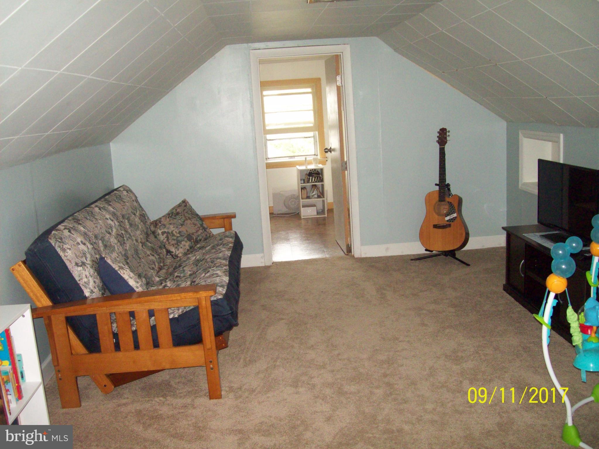 12411 Big Spring Road Clear Spring, MD 21722 - Photo 13 of 17 a living room with furniture and a flat screen tv
