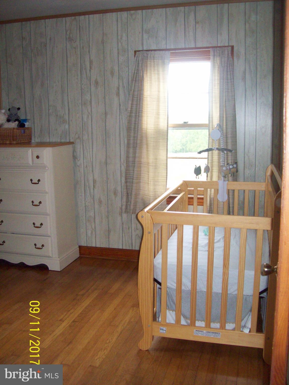 12411 Big Spring Road Clear Spring, MD 21722 - Photo 6 of 17 a view of a bedroom with window