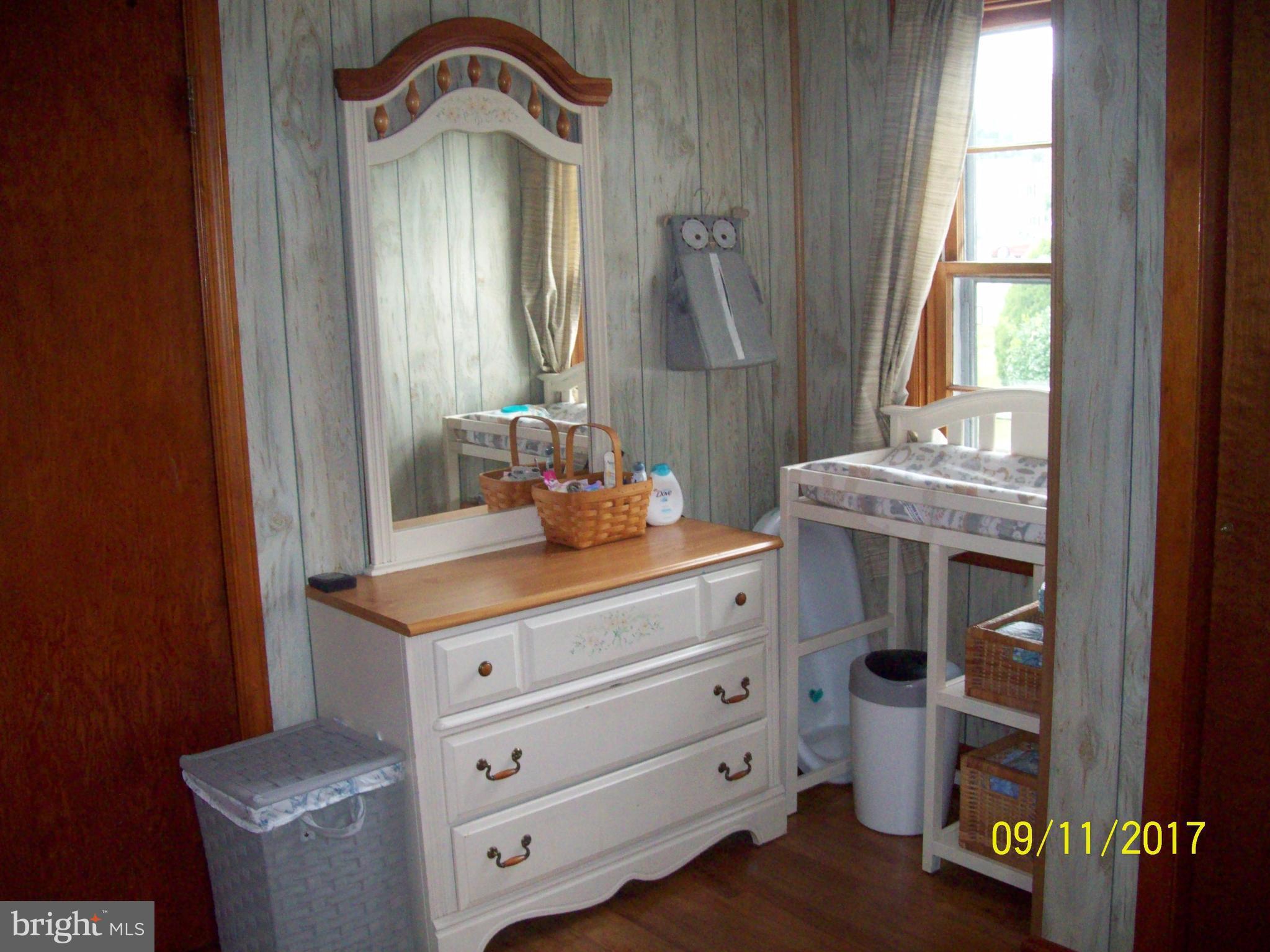 12411 Big Spring Road Clear Spring, MD 21722 - Photo 7 of 17 a bathroom with a sink and a mirror