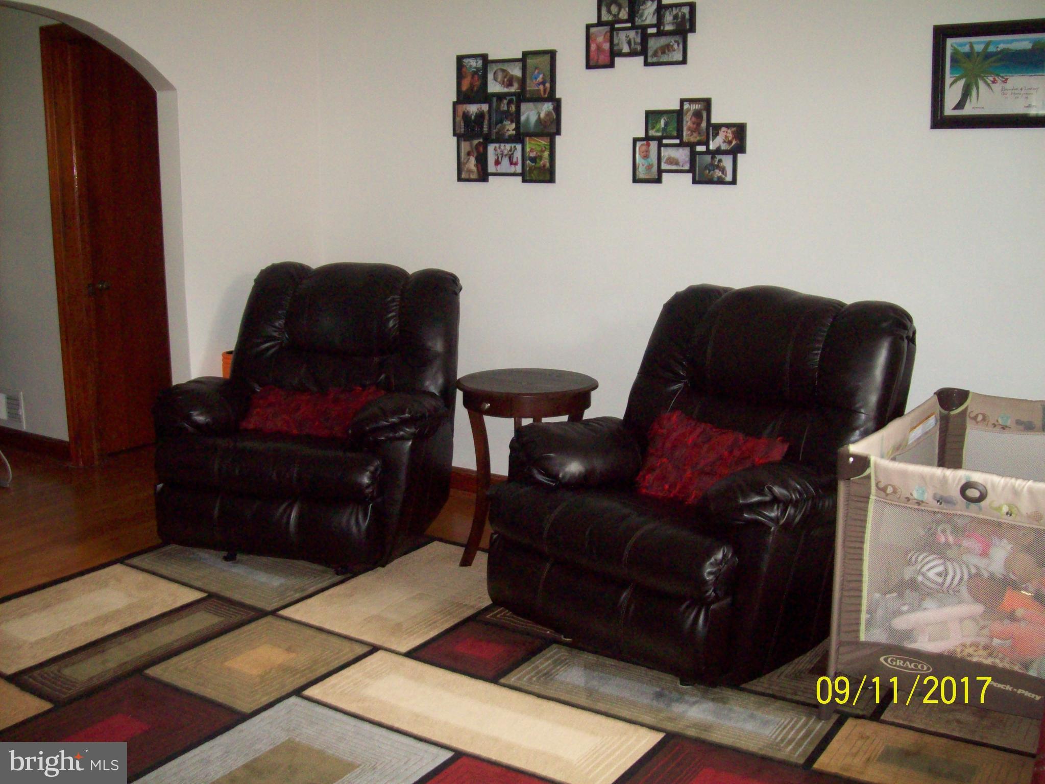 12411 Big Spring Road Clear Spring, MD 21722 - Photo 8 of 17 a living room with furniture and a couch